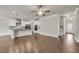 Spacious open floor plan featuring living room, kitchen with bar seating, and staircase at 5140 Woodline View Cir, Auburn, GA 30011