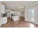 Open-concept living space with kitchen, dining, and living areas featuring modern finishes at 5140 Woodline View Cir, Auburn, GA 30011