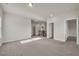 Spacious loft area with neutral carpet and ample natural light from large windows at 5140 Woodline View Cir, Auburn, GA 30011