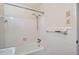 Bathroom featuring tiled walls and a combined tub and shower at 6435 E Glen Rd, Lithonia, GA 30038