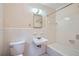 Bathroom featuring tiled walls and a combined tub and shower at 6435 E Glen Rd, Lithonia, GA 30038
