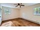 Bright bedroom with hardwood floors, natural light, and closet at 6435 E Glen Rd, Lithonia, GA 30038