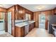 Traditional kitchen with wood cabinets, white counters, and stainless steel appliances at 6435 E Glen Rd, Lithonia, GA 30038
