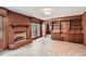 Bright living room featuring a brick fireplace, and tile floors at 6435 E Glen Rd, Lithonia, GA 30038
