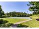 Well-maintained basketball court with vibrant lines, hoop and a scenic backdrop at 307 Downing Creek Trl, Canton, GA 30114