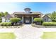 Inviting clubhouse with stone facade and well-manicured landscaping at 307 Downing Creek Trl, Canton, GA 30114