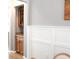 Dining area featuring wainscoting, a built-in cabinet and hardwood floors at 307 Downing Creek Trl, Canton, GA 30114
