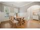 Dining room with natural light, wainscoting, and a wooden table with chairs at 307 Downing Creek Trl, Canton, GA 30114