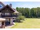 Stunning two-story home with a well-manicured lawn, large balcony, and stone accents at 307 Downing Creek Trl, Canton, GA 30114
