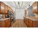 Kitchen featuring stainless steel appliances, stone countertops, and hardwood floors at 307 Downing Creek Trl, Canton, GA 30114