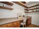Home office with floating wood shelves and built in desk at 307 Downing Creek Trl, Canton, GA 30114