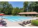 Community pool featuring lap lanes, lounge chairs, and a covered pavilion at 307 Downing Creek Trl, Canton, GA 30114