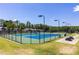 Community tennis courts with green and blue surface and picnic tables nearby at 307 Downing Creek Trl, Canton, GA 30114