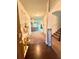 Inviting foyer with hardwood floors, staircase, and a view to the living area at 5243 Cantbury Way, Atlanta, GA 30349