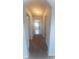 Well-lit hallway showcasing multiple rooms and a bathroom, all connected by plush carpeting for comfort at 5243 Cantbury Way, Atlanta, GA 30349