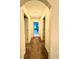 Hallway with neutral paint and carpet leading to other rooms in the house at 5243 Cantbury Way, Atlanta, GA 30349