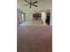 Open concept kitchen with stainless steel appliances, island seating, and seamless transition to the living area at 5243 Cantbury Way, Atlanta, GA 30349