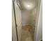 A laundry room features tiled floors and a wire shelf at 5243 Cantbury Way, Atlanta, GA 30349