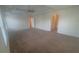 Expansive main bedroom with tray ceiling, plush carpeting, and ample space for a relaxing retreat at 5243 Cantbury Way, Atlanta, GA 30349