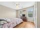Cozy bedroom with wood floors, natural light and ceiling fan at 642 Towering Pine Trl, Lawrenceville, GA 30045