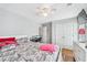 Bedroom featuring a ceiling fan, closet doors and a white dresser at 642 Towering Pine Trl, Lawrenceville, GA 30045