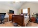 Bedroom features a queen-sized bed, a TV, and a window at 726 Fir Chase, Fairburn, GA 30213