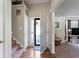 Bright foyer with staircase, coat closet, and view into living area with natural light at 726 Fir Chase, Fairburn, GA 30213