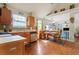 Bright, updated kitchen features stainless appliances, wood cabinetry, and breakfast nook with bench seating at 726 Fir Chase, Fairburn, GA 30213