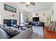 Cozy living room features hardwood floors, modern decor, and lots of natural light at 726 Fir Chase, Fairburn, GA 30213