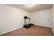 Finished basement with treadmill and a white door at 902 Brumley Nw Ln, Kennesaw, GA 30152