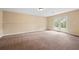 Basement showcasing French doors and neutral colored carpet at 902 Brumley Nw Ln, Kennesaw, GA 30152