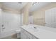 Clean bathroom features a tub/shower combo, large vanity, and a well-lit mirror at 902 Brumley Nw Ln, Kennesaw, GA 30152
