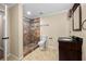 Bathroom showcasing a stylish vanity and tiled walk-in shower with a tiled floor at 902 Brumley Nw Ln, Kennesaw, GA 30152