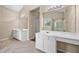 Bathroom with dual vanities, tile floors, and a large mirror reflecting the bright space at 902 Brumley Nw Ln, Kennesaw, GA 30152