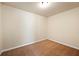Small bedroom with neutral carpet and walls, illuminated by ceiling light at 902 Brumley Nw Ln, Kennesaw, GA 30152