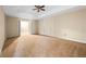 Spacious bedroom featuring a ceiling fan and an open doorway at 902 Brumley Nw Ln, Kennesaw, GA 30152