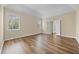 Spacious main bedroom with hardwood floors, a trey ceiling, and double doors to the ensuite bathroom at 902 Brumley Nw Ln, Kennesaw, GA 30152