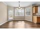 Bright dining area features wood floors, multiple windows, and a door to the outside deck at 902 Brumley Nw Ln, Kennesaw, GA 30152