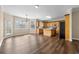 Open kitchen and dining area featuring wood floors, neutral walls, and lots of natural light at 902 Brumley Nw Ln, Kennesaw, GA 30152