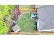Aerial view showcasing the large backyard, patio area, mature trees, and well-maintained landscaping at 230 Hickory Chase, Canton, GA 30115