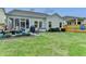 Spacious backyard with green lawn, charming patio, and landscaped garden beds, perfect for recreation and relaxation at 230 Hickory Chase, Canton, GA 30115