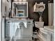 Well-lit bathroom featuring a vanity with marble countertop and white cabinets at 230 Hickory Chase, Canton, GA 30115