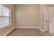 Empty bedroom featuring a window and neutral carpeting at 230 Hickory Chase, Canton, GA 30115