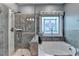 Spa like main bathroom features shower, tub and designer window at 230 Hickory Chase, Canton, GA 30115