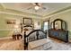 Comfortable main bedroom features a large window and tray ceiling at 230 Hickory Chase, Canton, GA 30115