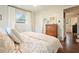 Cozy bedroom features hardwood floors, a window, and an entrance to another room in the house at 2449 Fraser Rd, Marietta, GA 30066
