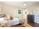 Cozy bedroom with hardwood flooring, soft textiles, and natural light from the window at 2449 Fraser Rd, Marietta, GA 30066