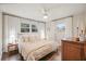 Bright bedroom features hardwood floors, ceiling fan, and two windows for plenty of natural light at 2449 Fraser Rd, Marietta, GA 30066