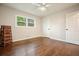Bright bedroom features hardwood floors, a window, ceiling fan, and neutral paint at 2449 Fraser Rd, Marietta, GA 30066
