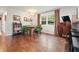 Cozy dining area with a round table, dark wood floors, a window and built-in banquette seating at 2449 Fraser Rd, Marietta, GA 30066